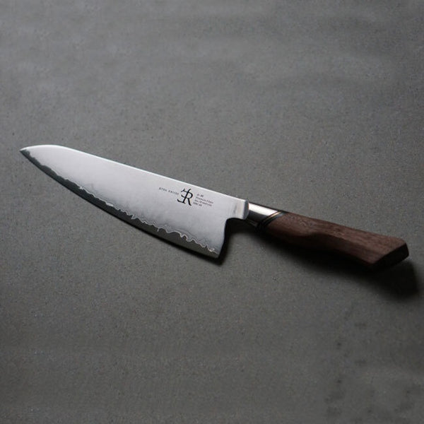 Chef's knife with a wooden handle on a gray background