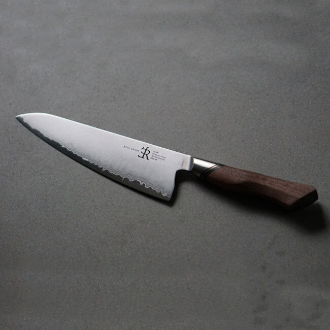 Chef's knife with a wooden handle on a gray background