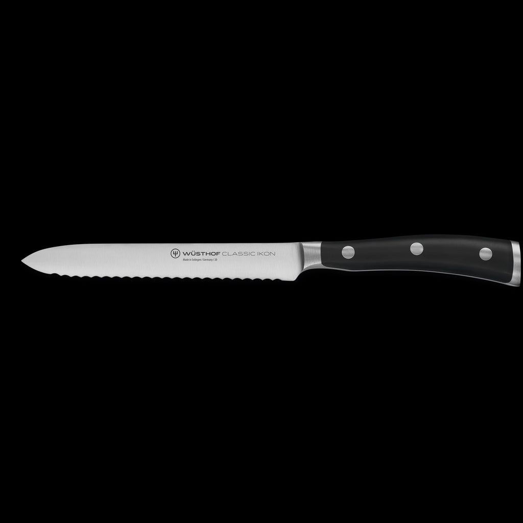 Wusthof Classic Ikon serrated utility knife on a white background