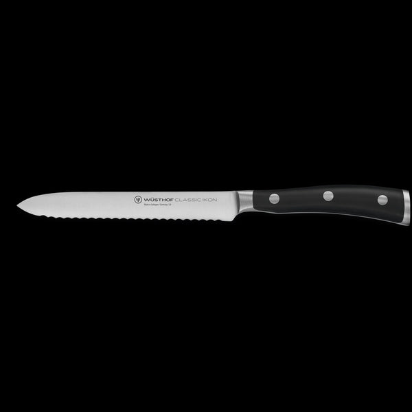 Wusthof Classic Ikon serrated utility knife on a white background