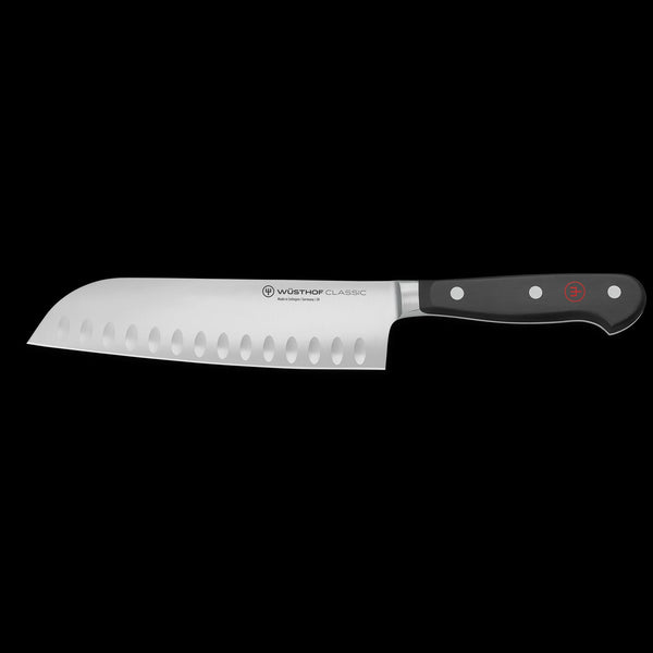 Wusthof Hollow Edge knife with black handle on a white background
