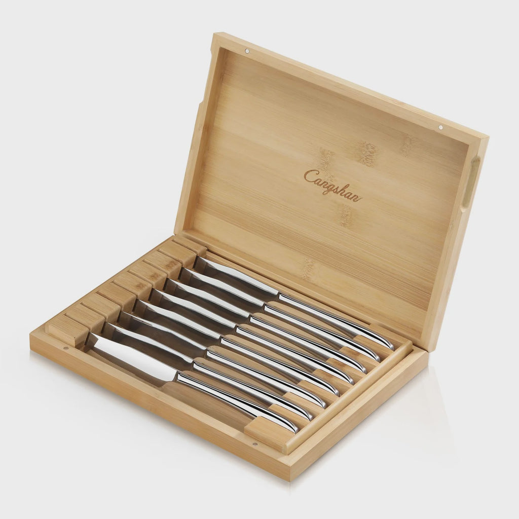 Set of silver steakknives in a bamboo box with 'Cangshan' branding on a white background