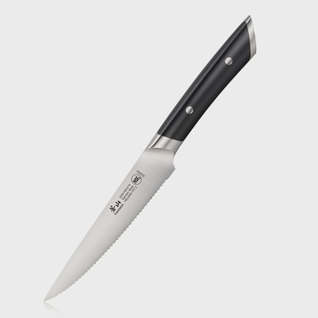 Serrated kitchen knife with a black handle on a white background