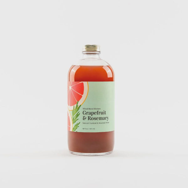 Bottle of Grapefruit & Rosemary cocktail mix on a white background