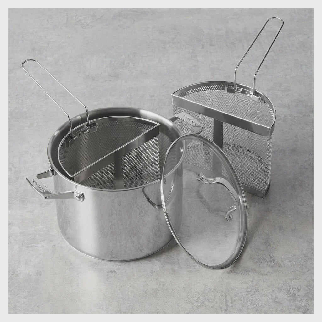 Stainless steel pot with lid and strainer on a gray concrete surface