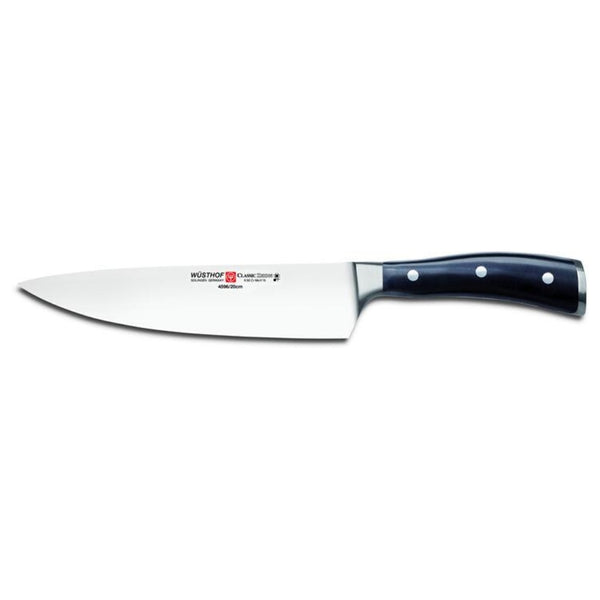 Wusthof Chef's knife with a black handle on a white background