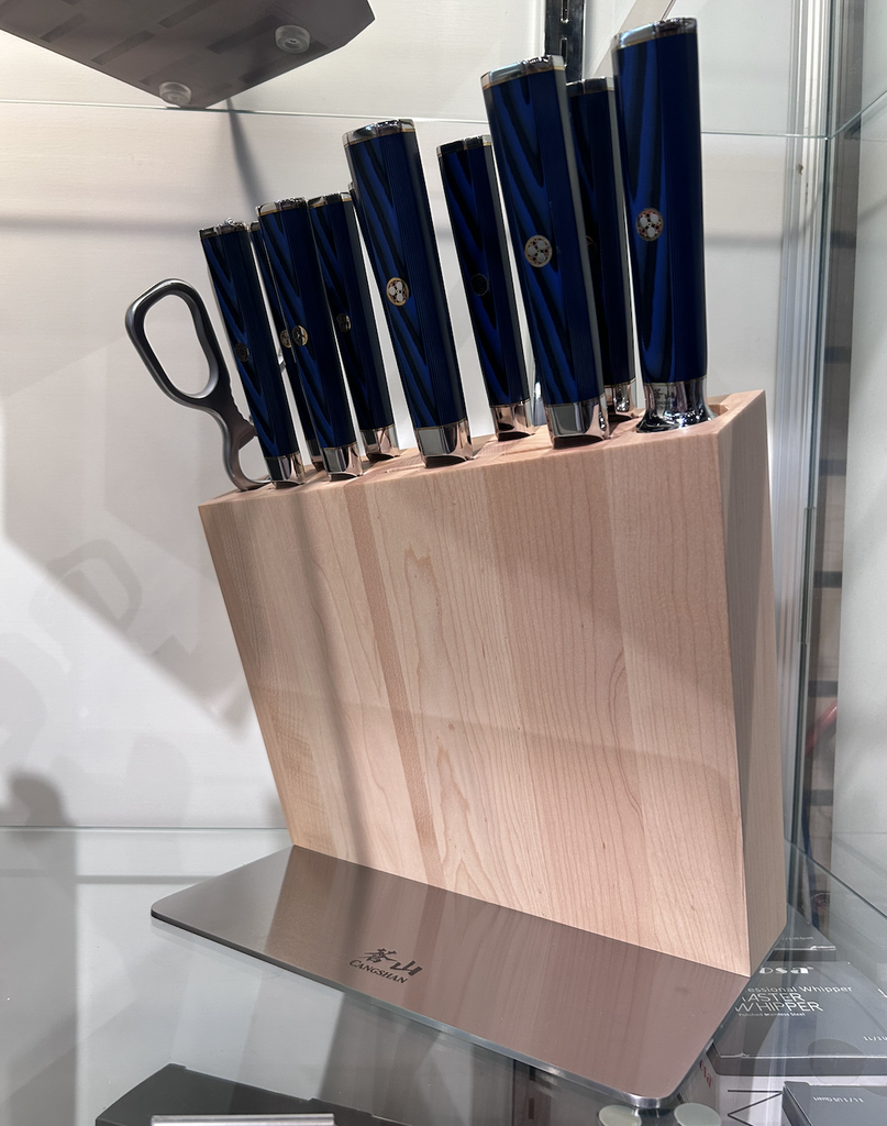 Set of knives in a wooden block on a kitchen counter