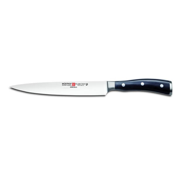 Carving knife with black handle on a white background
