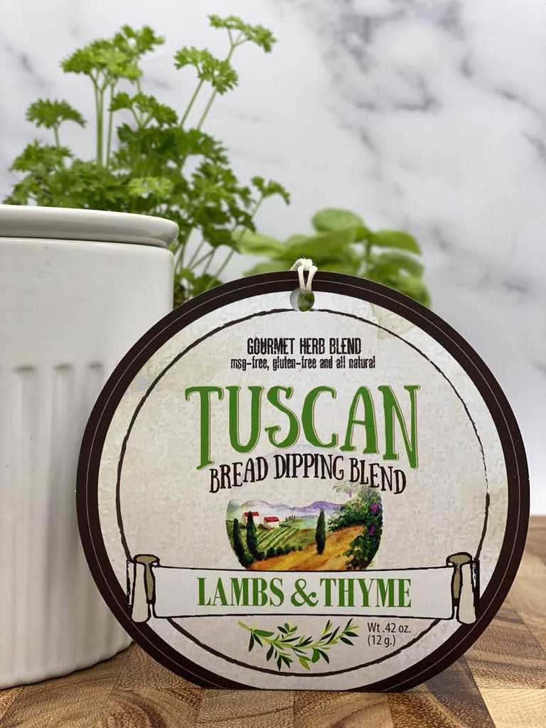 Tuscan Bread Dipping Blend label with a scenic design on a wooden surface.